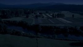 4K day for night color corrected aerial stock footage of the Snoqualmie River and farm fields in Carnation, Washington Aerial Stock Footage | AX48_037_DFN