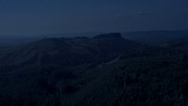 4K day for night color corrected aerial stock footage of green hills and evergreen forest in King County, Washington Aerial Stock Footage | AX48_049_DFN