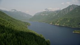 5K aerial stock footage fly over evergreen trees on mountain slope next to the South Fork Tolt Reservoir, Cascade Range, Washington Aerial Stock Footage | AX48_059
