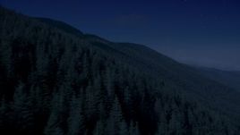 4K day for night color corrected aerial stock footage of mountain slopes covered with evergreen trees in the Cascade Range, Washington Aerial Stock Footage | AX48_060_DFN