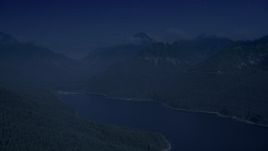 4K day for night color corrected aerial stock footage of wooded mountain peaks beside the South Fork Tolt Reservoir, Cascade Range, Washington Aerial Stock Footage | AX48_061_DFN