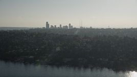 5K aerial stock footage of a view of the Downtown Seattle skyline from lakeside homes in Madrona, Washington Aerial Stock Footage | AX49_054