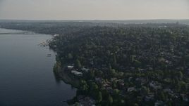 5K aerial stock footage of lakefront homes and suburban neighborhoods by Lake Washington, Madrona, Washington Aerial Stock Footage | AX49_055
