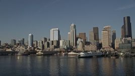 5K aerial stock footage of the Downtown Seattle skyline and the Central Waterfront seen from Elliott Bay, Washington Aerial Stock Footage | AX49_066