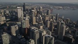5K aerial stock footage flyby tall Downtown Seattle skyscrapers and track Two Union Square with an American flag in Washington Aerial Stock Footage | AX49_073E