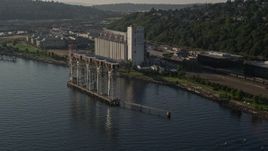 5K aerial stock footage flyby grain elevator on the shore of Elliott Bay in Seattle, Washington Aerial Stock Footage | AX49_088