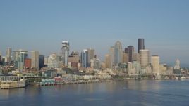5K aerial stock footage of Downtown Seattle skyline and Waterfront seen from Elliott Bay, Washington Aerial Stock Footage | AX49_091