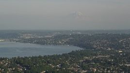 5K aerial stock footage of homes around Lake Washington, and Mount Rainier in the background, Seattle, Washington Aerial Stock Footage | AX49_096