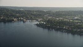 5K aerial stock footage of lakefront homes on the shore of Lake Washington by marina, Rainier Beach, Seattle, Washington Aerial Stock Footage | AX49_099