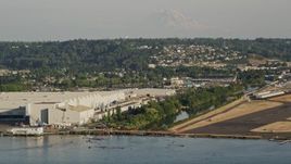 5K aerial stock footage approach the Boeing Factory from Lake Washington in Renton, Washington Aerial Stock Footage | AX49_102