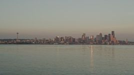 5K aerial stock footage tilt from Elliott Bay to reveal and approach the Downtown Seattle skyline and Space Needle at sunset, Washington Aerial Stock Footage | AX50_017