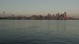 5K aerial stock footage tilt from Elliott Bay to reveal the Seattle Space Needle and Downtown Seattle skyline, Washington, sunset Aerial Stock Footage | AX50_018E