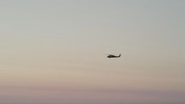 5K aerial stock footage of tracking a Blackhawk helicopter at sunset, Seattle, Washington Aerial Stock Footage | AX50_040