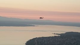 5K aerial stock footage of tracking a helicopter over Puget Sound, Washington, sunset Aerial Stock Footage | AX50_041