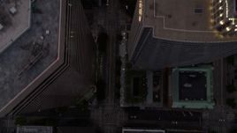 5K aerial stock footage of bird's eye view of following 3rd Avenue, passing skyscrapers, Downtown Seattle, Washington, sunset Aerial Stock Footage | AX50_059E