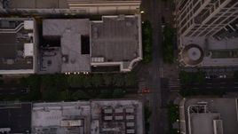 5K aerial stock footage of bird's eye view of 5th Avenue and city buildings in Downtown Seattle, Washington, sunset Aerial Stock Footage | AX50_062
