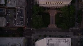 5K aerial stock footage of bird's eye of 5th Avenue with light traffic and city buildings in Downtown Seattle, Washington, sunset Aerial Stock Footage | AX50_063