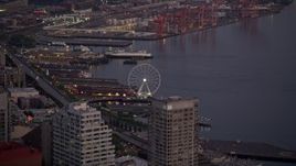 5K aerial stock footage track the Seattle Great Wheel behind the Seattle Aquarium, Downtown Seattle, Washington, sunset Aerial Stock Footage | AX50_079