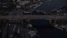 5K aerial stock footage of bird's eye view of light traffic crossing the Ship Canal Bridge, Seattle, Washington, twilight Aerial Stock Footage | AX50_084