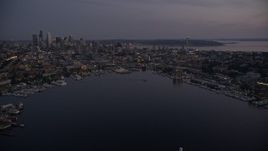 5K aerial stock footage fly over the Capitol Hill neighborhood and Lake Union to approach Downtown Seattle skyline, twilight Aerial Stock Footage | AX50_088E