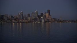 5K aerial stock footage of low approach to Downtown Seattle skyline at twilight, Washington Aerial Stock Footage | AX50_096E