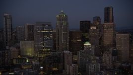 5K aerial stock footage of approach and flyby 1201 Third Avenue Tower at twilight in Downtown Seattle, Washington Aerial Stock Footage | AX50_098