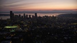 5K aerial stock footage of a wide view of Downtown Seattle, Washington, at twilight, with Elliott Bay in the background Aerial Stock Footage | AX50_100E
