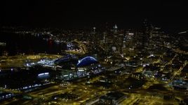 5K aerial stock footage approach Safeco and CenturyLink Fields, with a view of Downtown Seattle skyscrapers, Washington, night Aerial Stock Footage | AX51_007E