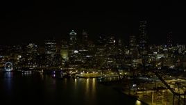 5K aerial stock footage of Downtown Seattle skyline, and the Seattle Great Wheel at the Waterfront at night, Washington Aerial Stock Footage | AX51_009