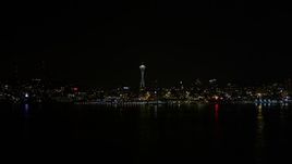 5K aerial stock footage fly over Elliott Bay to approach Space Needle, Downtown Seattle, Washington, night Aerial Stock Footage | AX51_012