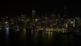 5K aerial stock footage of Downtown Seattle skyline and Central Waterfront piers, Washington, night Aerial Stock Footage | AX51_016E