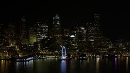 5K aerial  video of the Seattle Great Wheel and Waterfront piers, and Downtown Seattle skyline in Washington, nighttime Aerial Stock Footage | AX51_018