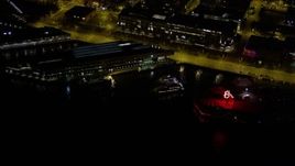 5K aerial stock footage of Pier 69 and the Edgewater Hotel at Central Waterfront, Downtown Seattle, Washington, night Aerial Stock Footage | AX51_023