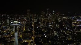 5K aerial stock footage of a view of Downtown Seattle skyscrapers, reveal the Space Needle, Washington, night Aerial Stock Footage | AX51_026
