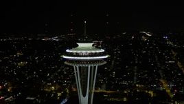 5K aerial stock footage orbit Space Needle in Downtown Seattle, with Elliott Bay and downtown in the background, Washington, night Aerial Stock Footage | AX51_031E