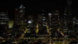 5K aerial stock footage of a view of Downtown Seattle skyscrapers at nighttime, Washington Aerial Stock Footage | AX51_041