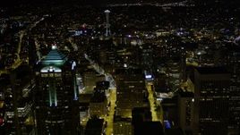 5K aerial stock footage fly over skyscrapers in Downtown Seattle to approach the Space Needle, Washington, night Aerial Stock Footage | AX51_051E