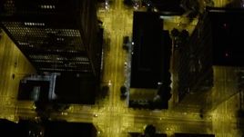 5K aerial stock footage of bird's eye view following 3rd Avenue past skyscrapers, Downtown Seattle, Washington, night Aerial Stock Footage | AX51_060E