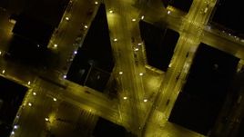 5K aerial stock footage of bird's eye pan across parking lots to reveal city streets, Downtown Seattle, Washington, night Aerial Stock Footage | AX51_062E