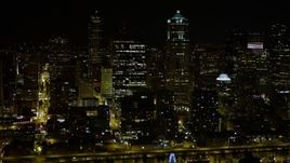 5K aerial stock footage of passing skyscrapers and high-rises in Downtown Seattle, Washington, night Aerial Stock Footage | AX51_072E
