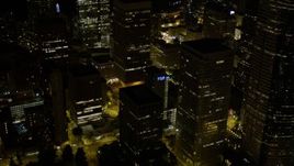 5K aerial stock footage reveal base of Rainier Tower in Downtown Seattle, Washington, night Aerial Stock Footage | AX51_086E