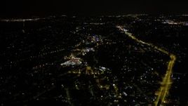 5K aerial stock footage fly over neighborhood to approach shopping center in Rainier Valley, Seattle, Washington, night Aerial Stock Footage | AX51_094E