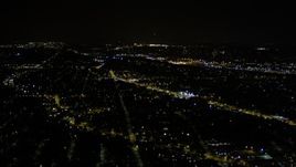 5K aerial stock footage tilt from a strip mall to reveal neighborhoods at night in Rainier Valley, Seattle, Washington Aerial Stock Footage | AX51_096E