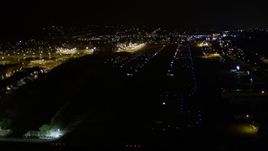 5K aerial stock footage approach Renton Municipal Airport runway from Lake Washington, night Aerial Stock Footage | AX51_101E