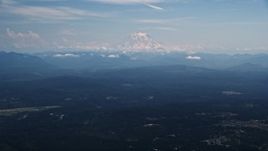 5K aerial stock footage of Mount Rainier with snow, an active volcano in Cascade Range, Washington Aerial Stock Footage | AX52_004
