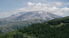 5K aerial stock footage approach Mount St. Helens, capped by clouds, Washington Aerial Stock Footage | AX52_040E
