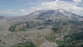 5K aerial stock footage approach Mount St. Helens and clouds capping the peak, Washington Aerial Stock Footage | AX52_044
