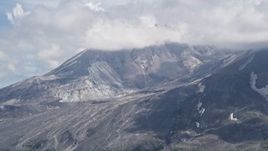 5K aerial stock footage of Mount St. Helens crater with cloud cover, Washington Aerial Stock Footage | AX52_045
