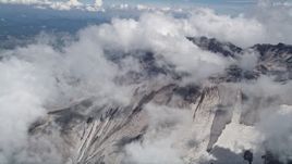 5K aerial stock footage orbit the Mount St. Helens crater with snow and low clouds, Washington Aerial Stock Footage | AX52_060