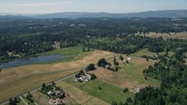 5K aerial stock footage of farms and fields near a small pond in La Center, Washington Aerial Stock Footage | AX52_073